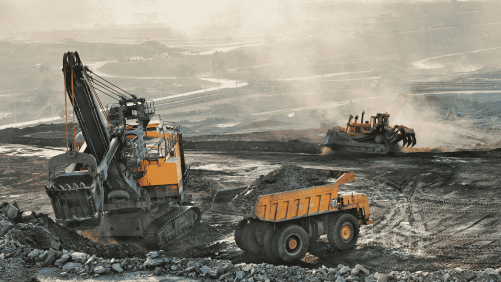 Heavy mining equipment operating at a copper mine in Zambia, highlighting investment and economic growth.