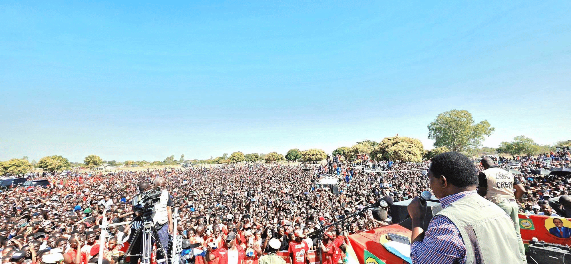 President Hakainde Hichilema addresses a large crowd at Shangombo Youth Grounds during a UPND campaign rally ahead of Zambia's 2026 general election.