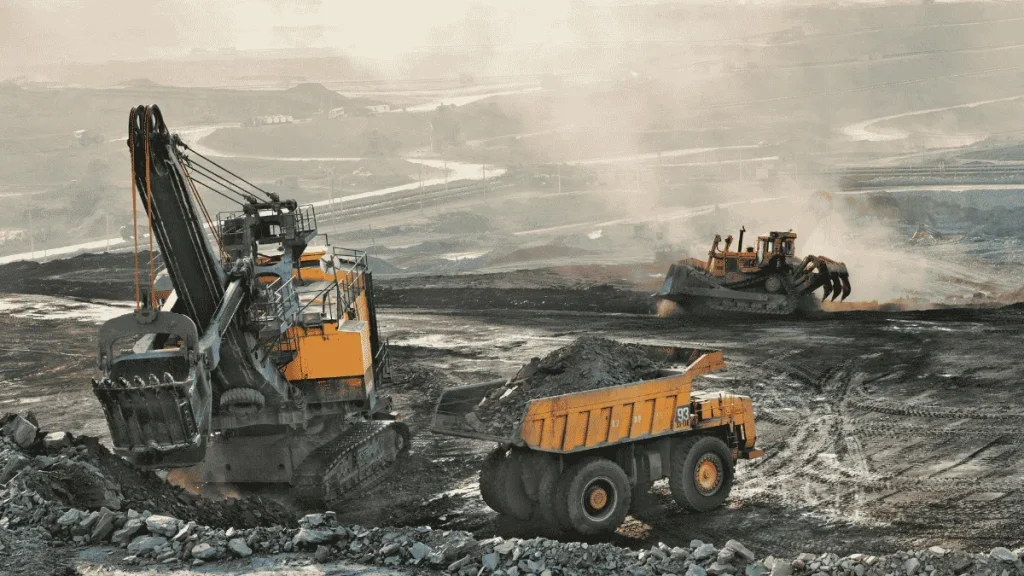 Heavy mining equipment operating at a copper mine in Zambia, highlighting investment and economic growth.