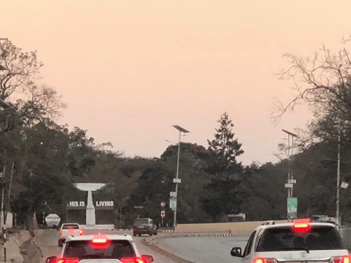 A Lusaka street early in the morning as traffic and trade begin