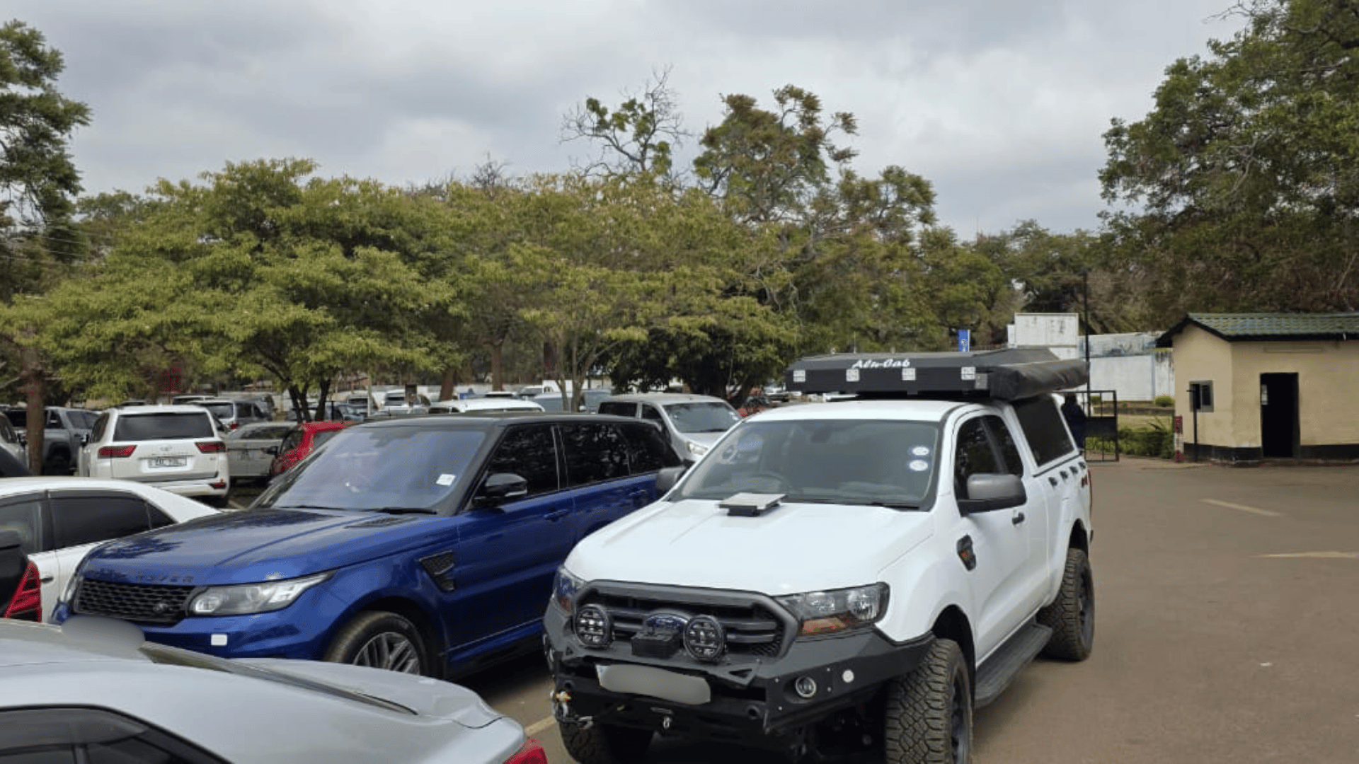 Vehicles parked at the Lusaka Golf Club polling station on Zambia's election day