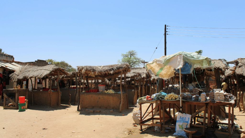 Zambian market traders at their stalls, illustrating small business activity during the wait for the 2026 presidential declaration