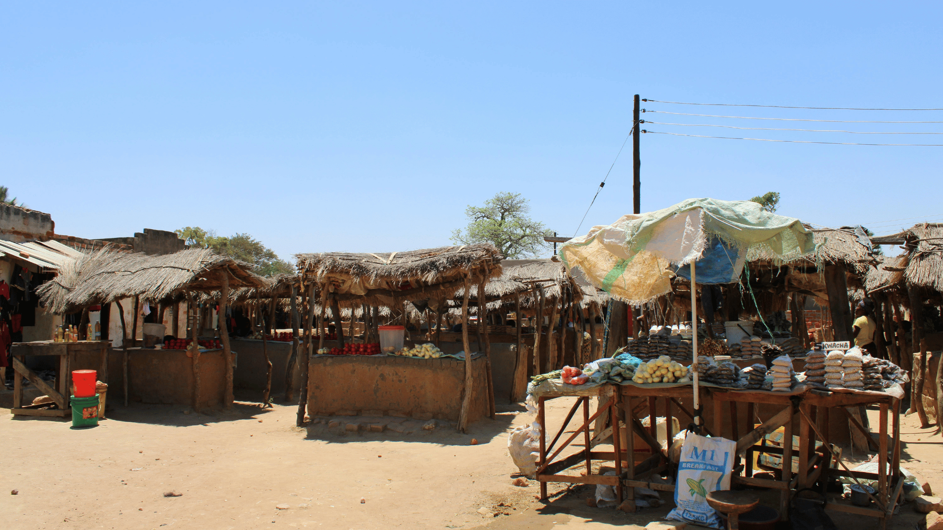Zambian market traders at their stalls, illustrating small business activity during the wait for the 2026 presidential declaration