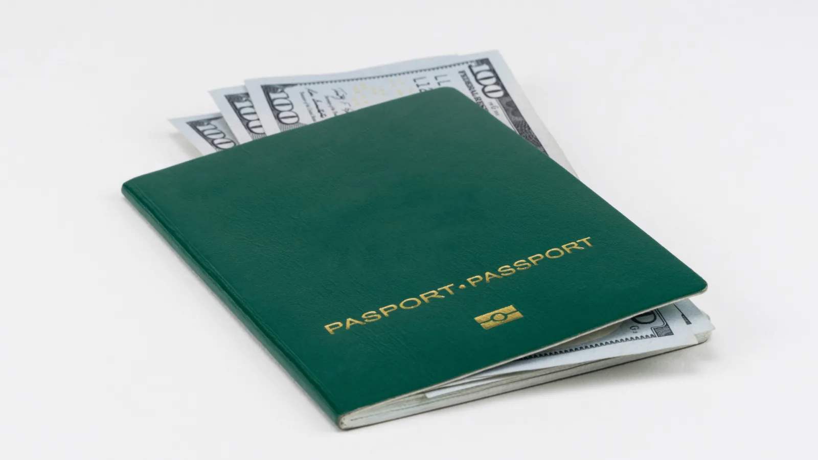 Zambian passport resting on banknotes, representing citizenship, dignity and access to economic opportunity
