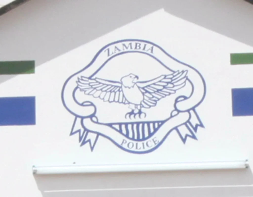 Zambia Police emblem at a police station following the recovery of an ECZ laptop in Mandevu