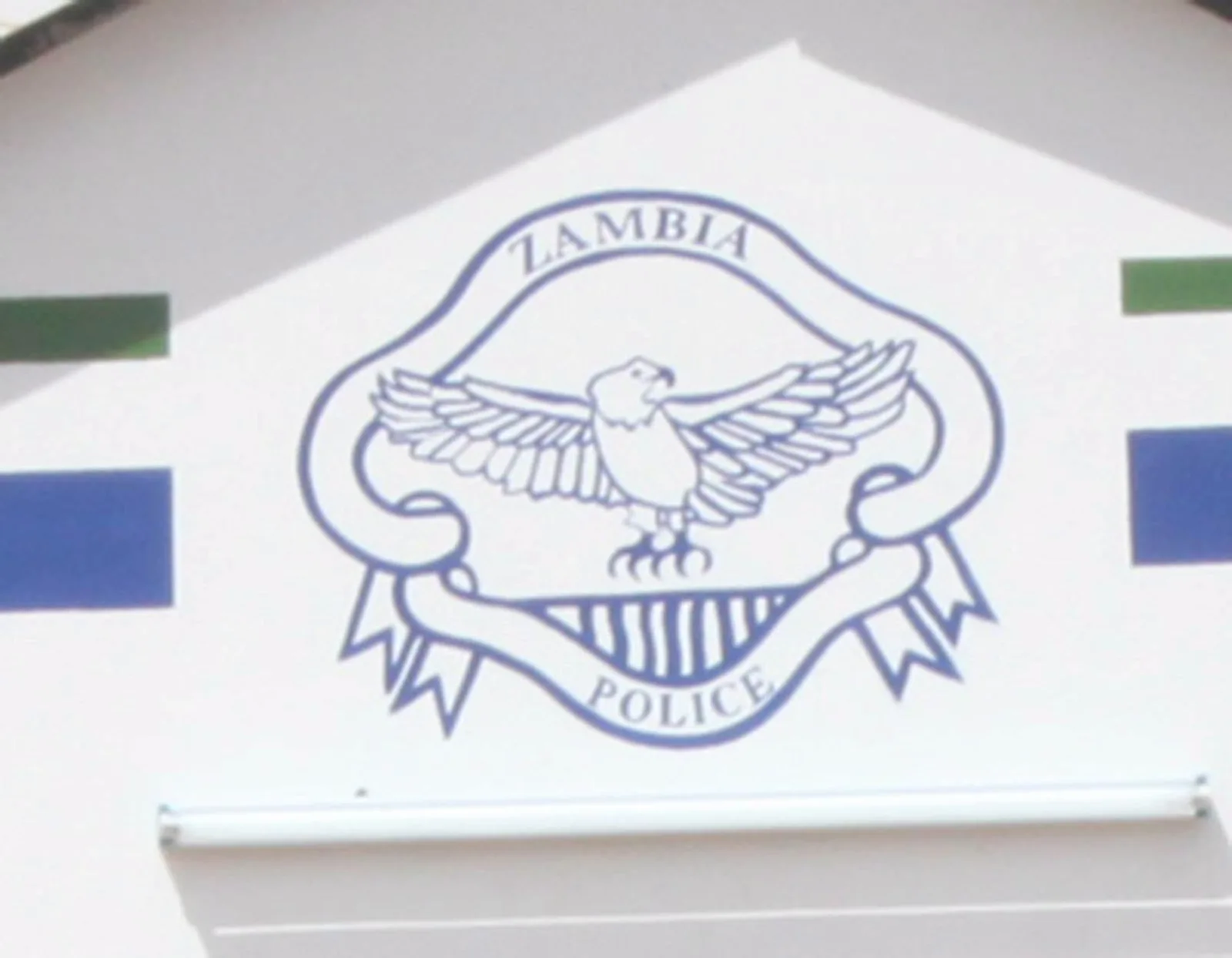Zambia Police emblem at a police station following the recovery of an ECZ laptop in Mandevu