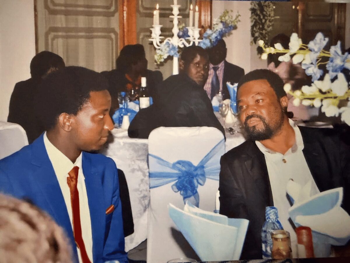 Dr. Canisius Banda and Hon. Imanga Wamunyima Jr seated together at Wamunyima's wedding reception