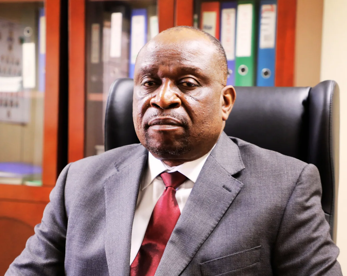 Dr Ron Mwambwa, former acting Auditor General of Zambia, seated at a boardroom table