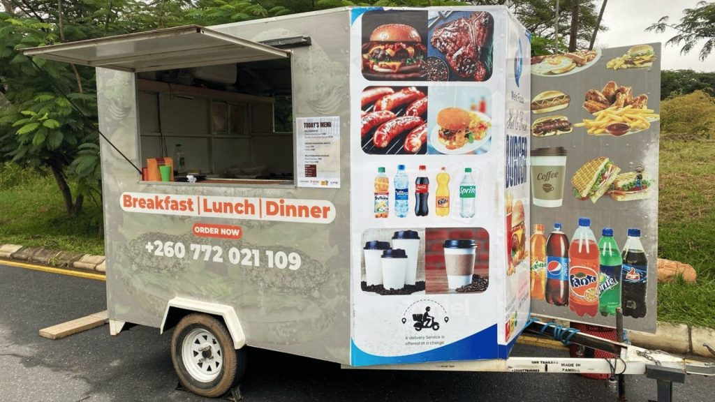 Mobile food trailer selling meals, bottled drinks and coffee in Zambia