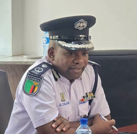 Police spokesperson Godfrey Chilabi speaking at a meeting