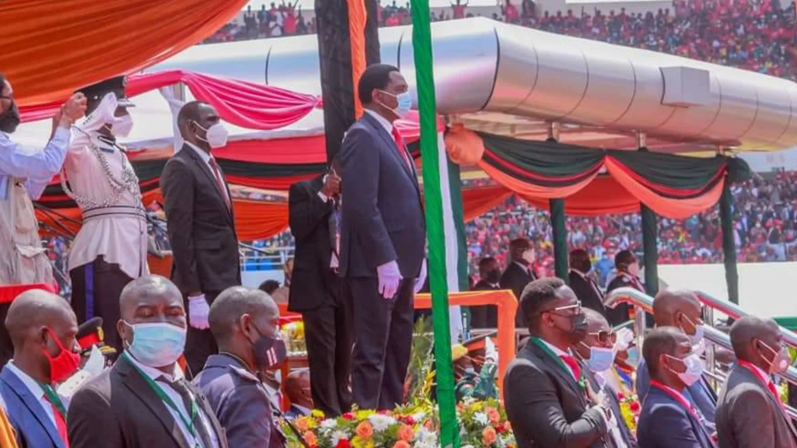 Zambian President Hakainde Hichilema speaking at a public ceremony in a dark suit