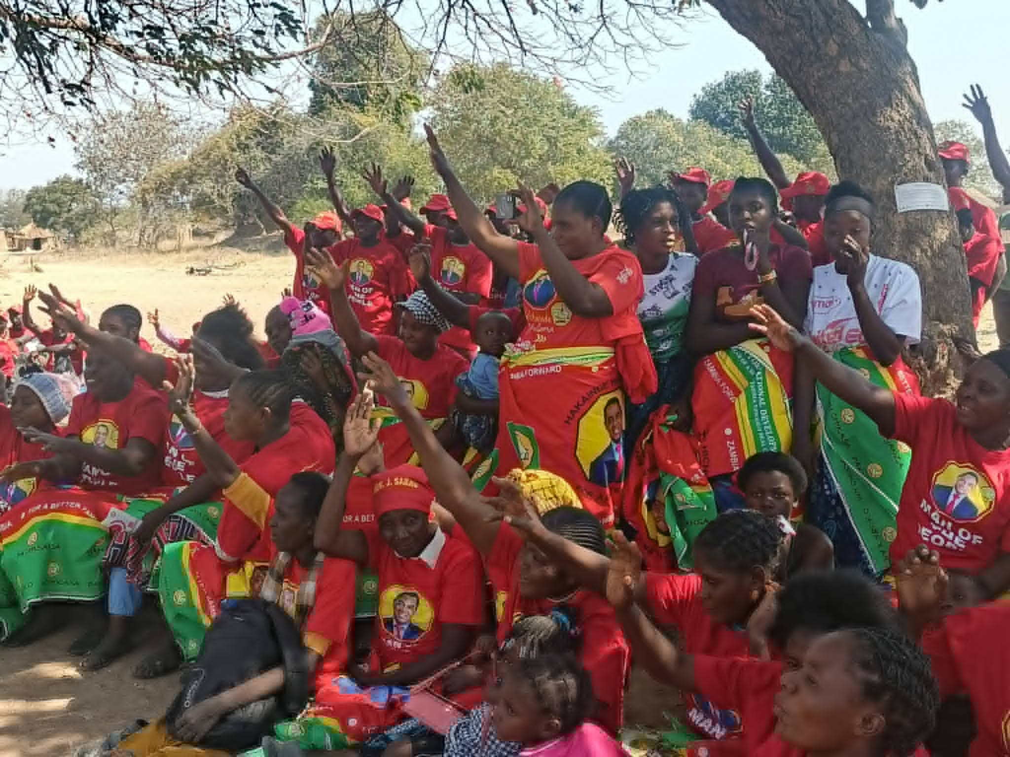 UPND supporters raise their hands during a Jacqueline Sabao campaign meeting