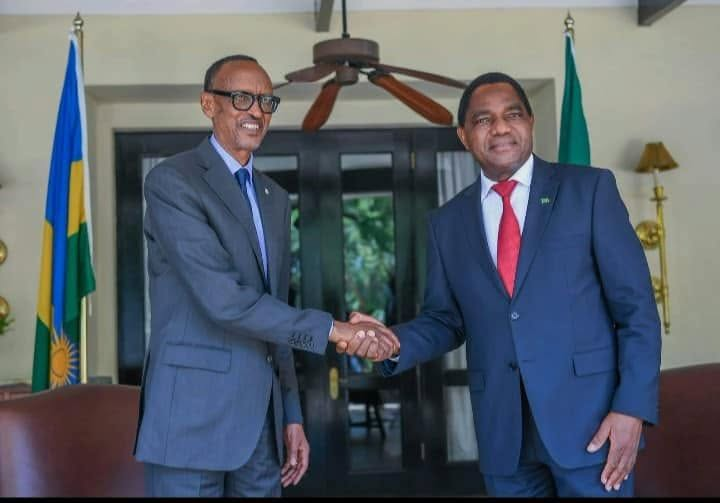 President Paul Kagame of Rwanda shakes hands with Zambian President Hakainde Hichilema.