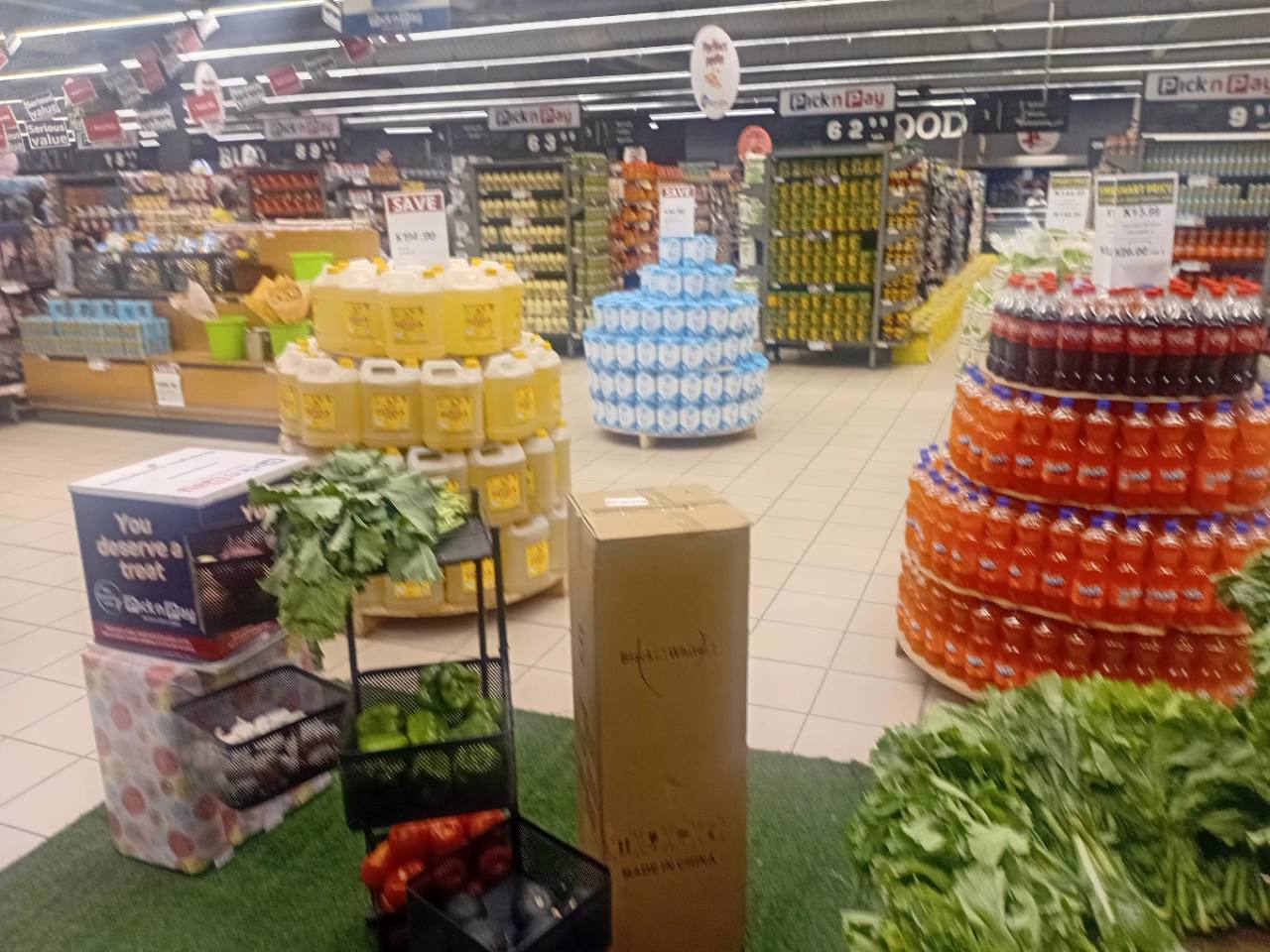 Fresh vegetables, beverages and household grocery displays inside Pick n Pay at Centro Mall