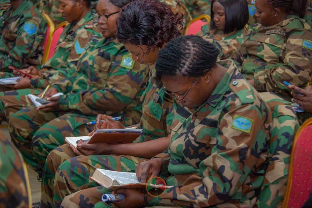 Zambia Air Force personnel read the Bible at the peaceful elections prayer service