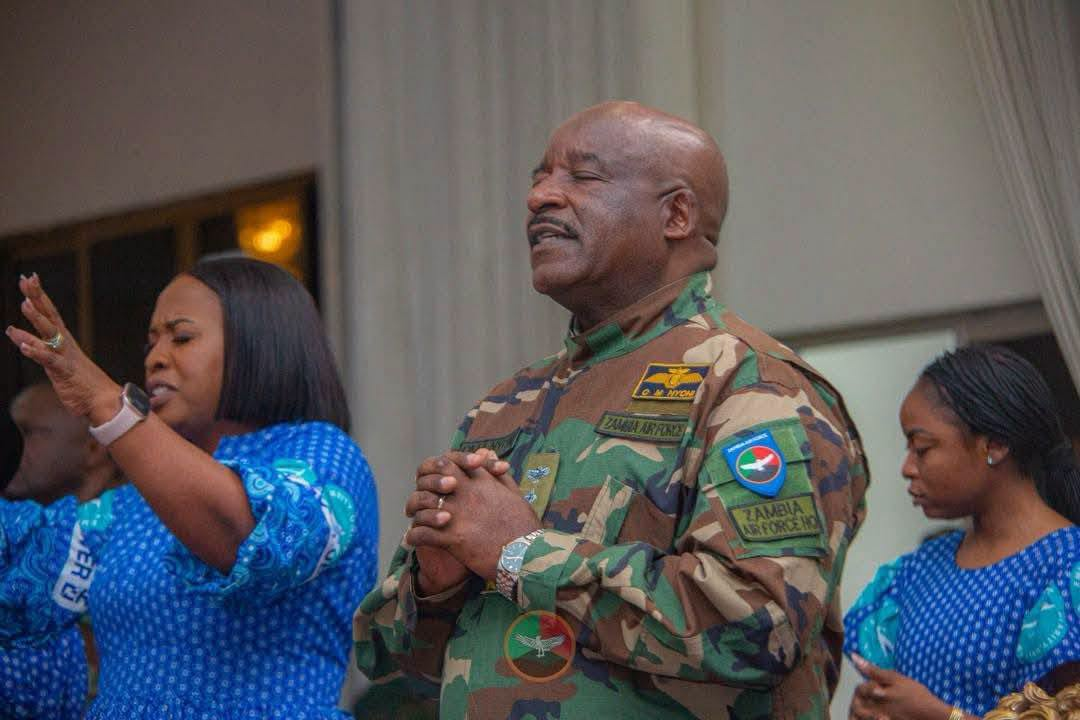Lieutenant General Oscar Nyoni prays at the Zambia Air Force intercessory service in Lusaka