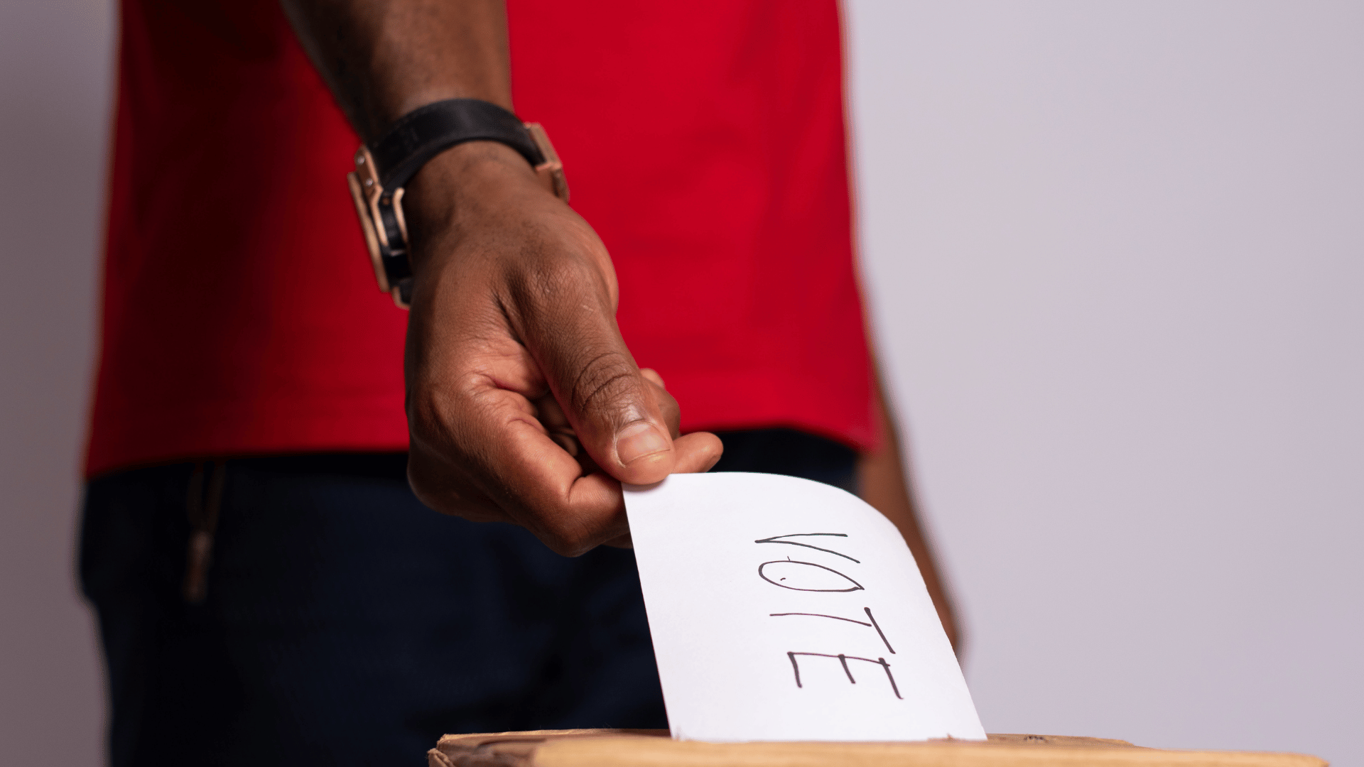 A voter placing a marked voting paper into a ballot box ahead of Zambia’s 13 August 2026 election.