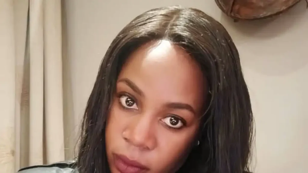 Nenne Sharon Mwale, mental health activist, in a black leather jacket