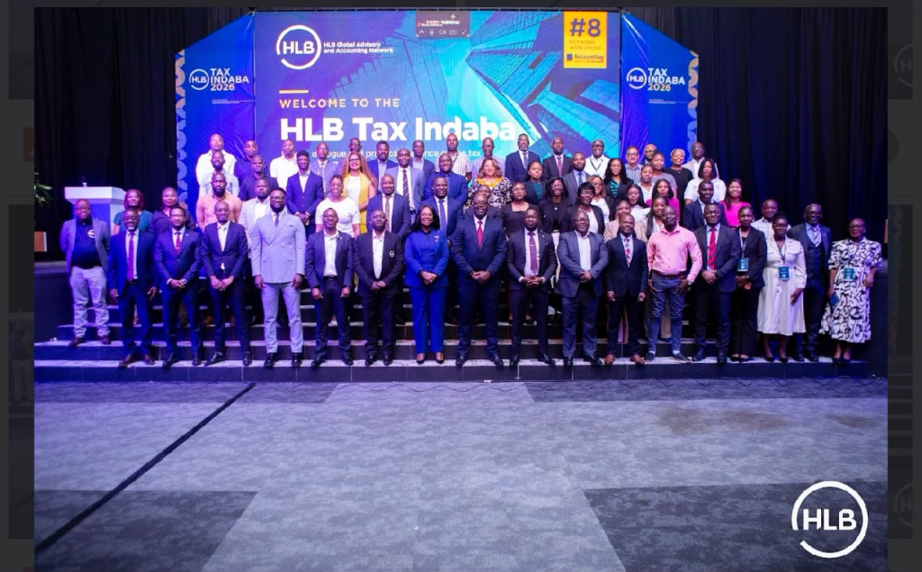 Delegates pose for a group photograph in front of the HLB Tax Indaba 2026 stage in Lusaka.