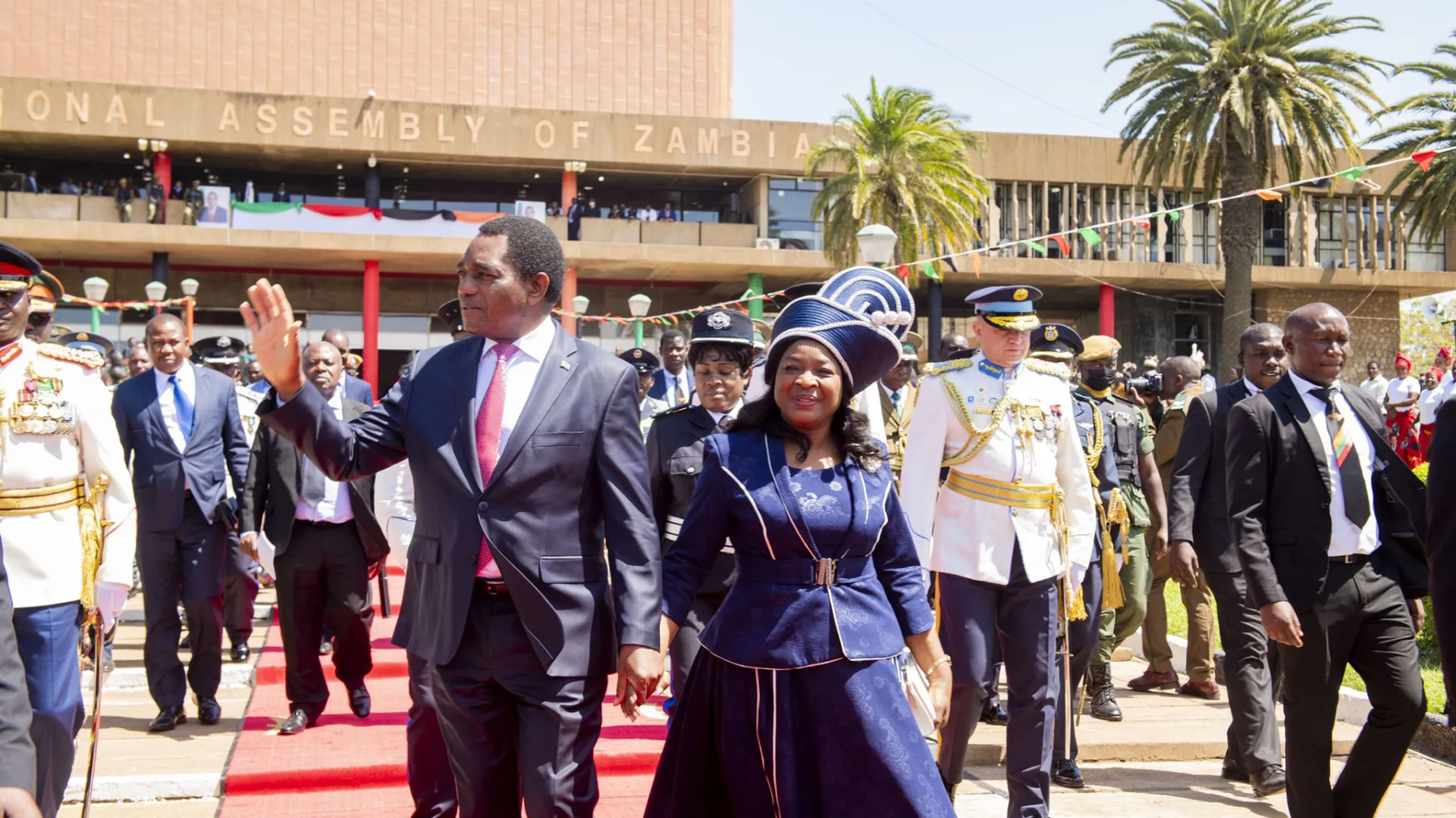 President Hakainde Hichilema waves as he arrives with First Lady Mutinta Hichilema at Parliament Buildings in Lusaka for the official opening of the National Assembly
