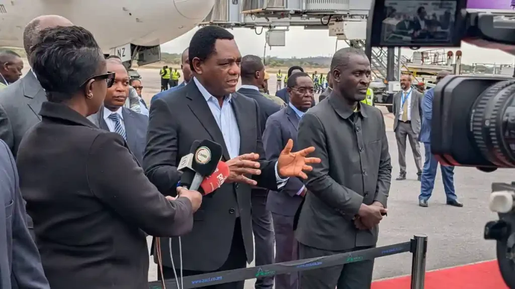 President Hakainde Hichilema speaks to journalists on the tarmac at Kenneth Kaunda International Airport after returning from his working visit to Abu Dhabi