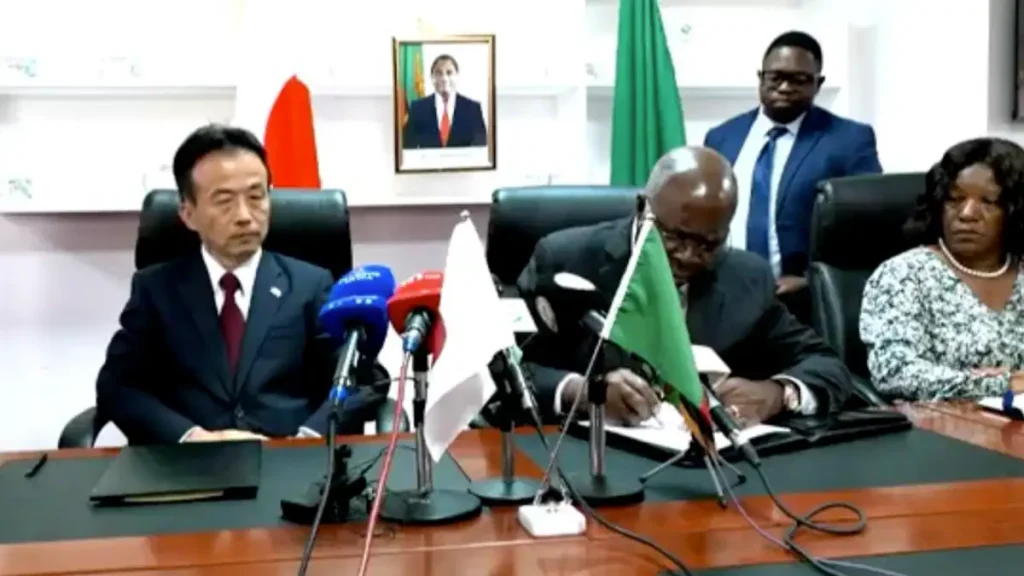 Finance Minister Dr Situmbeko Musokotwane signs the Japan grant agreement for railway maintenance alongside Japanese Ambassador Mikami Akiteru in Lusaka.