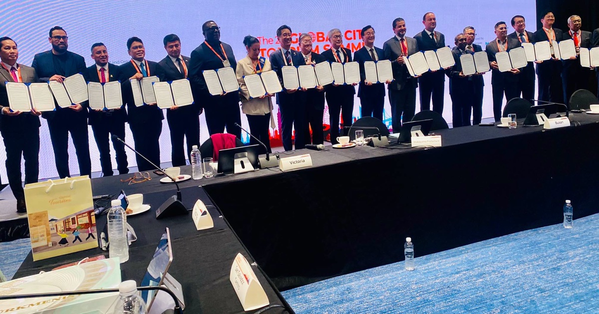 Mayors and delegates seated at a long conference table during the 2nd Global City Tourism Summit 2026 in Busan, South Korea, where Lusaka Mayor Chitambala Mwewa delivered his Mayoral Statement