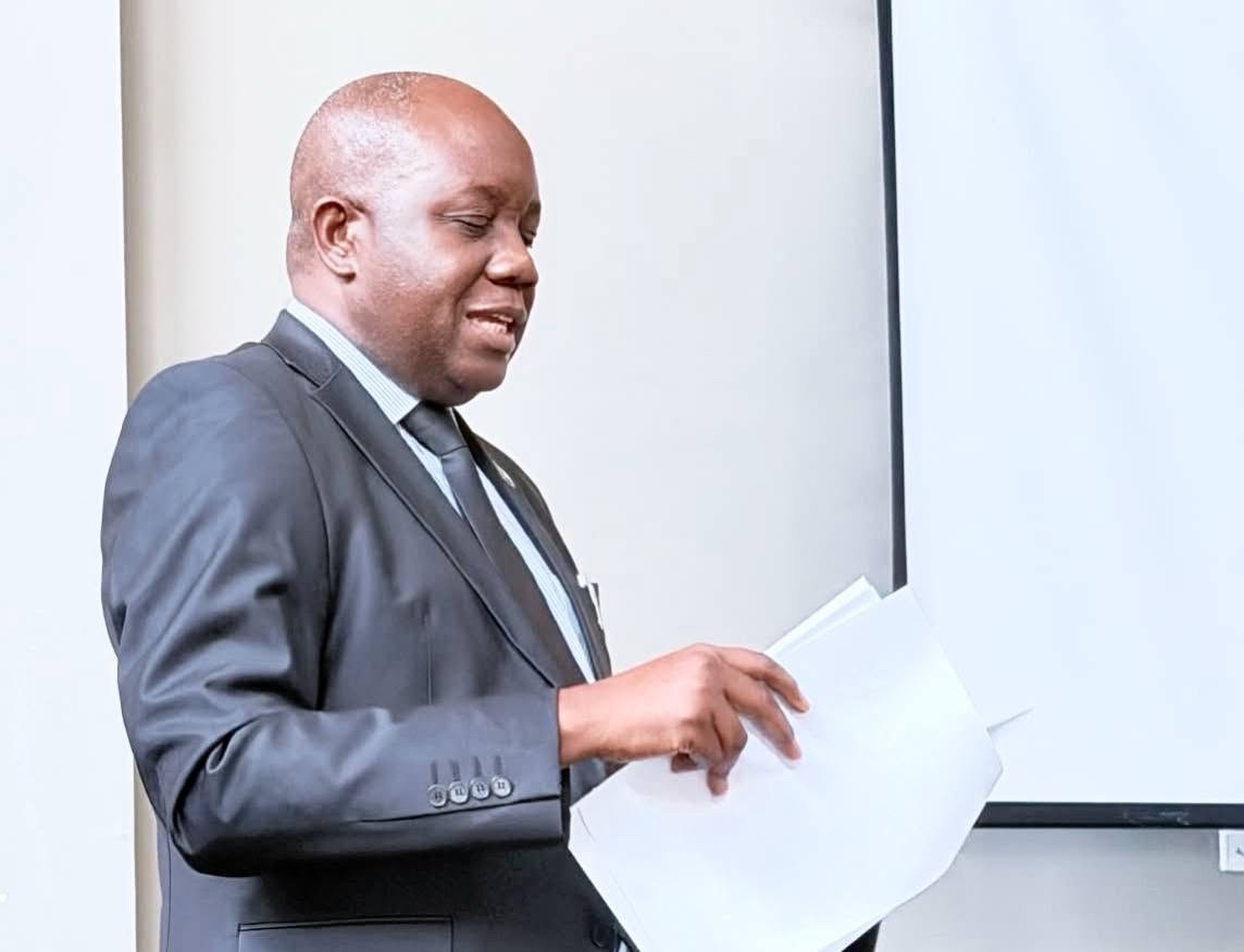 A facilitator addressing delegates during the OAG 2027-2031 Strategic Planning Meeting at Legacy Resort
