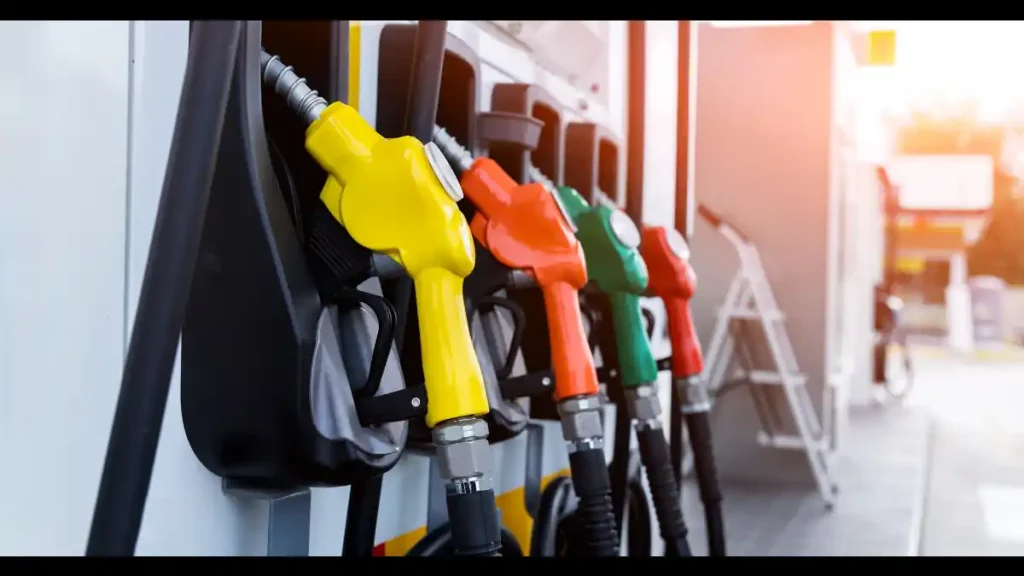 Row of yellow, orange, green and red fuel pump nozzles at a filling station after Zambia raised petrol to K31.46 and diesel to K33.27 a litre in October 2026